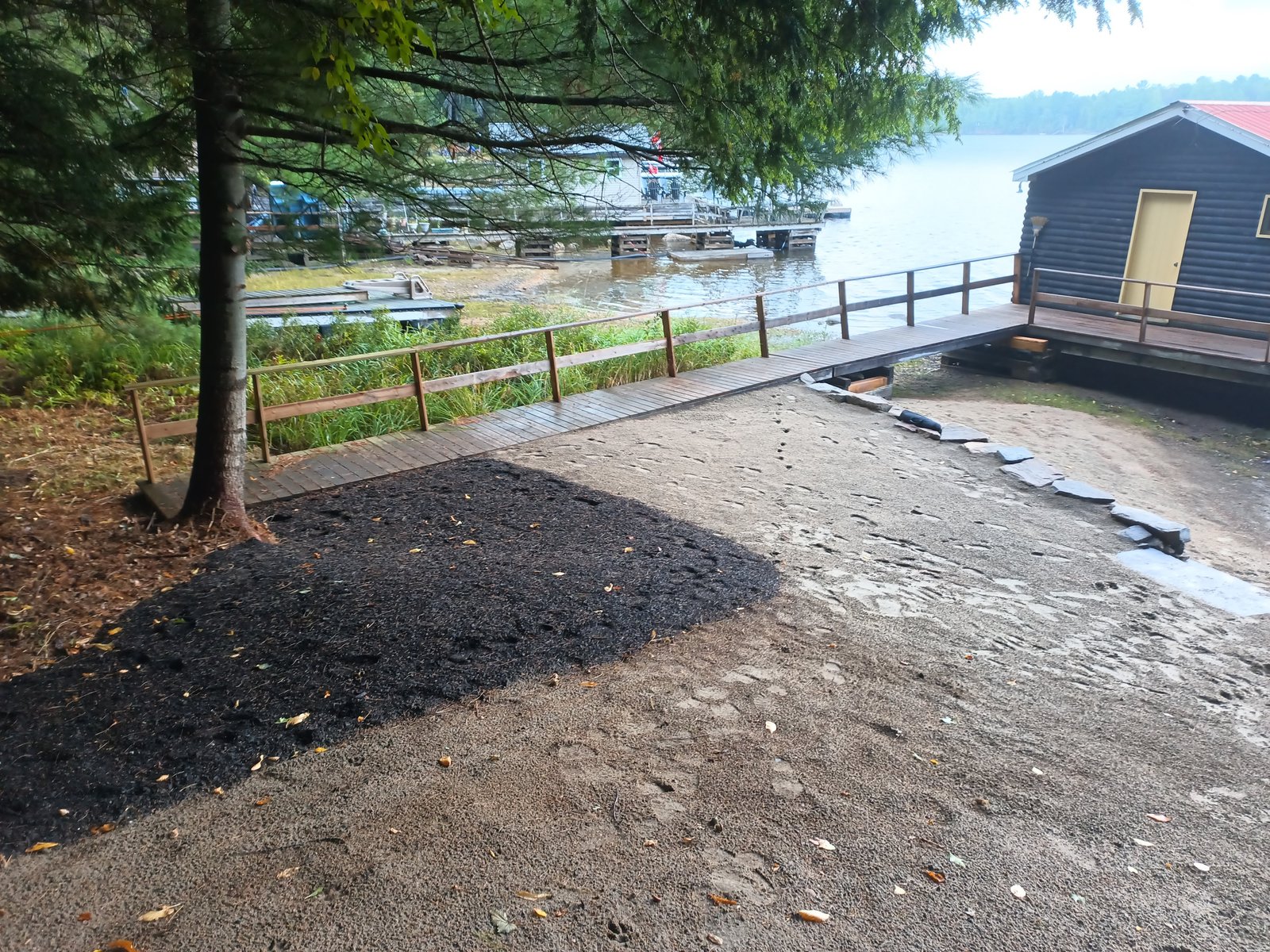 Lakeside view showing the prepared bowl area and boathouse